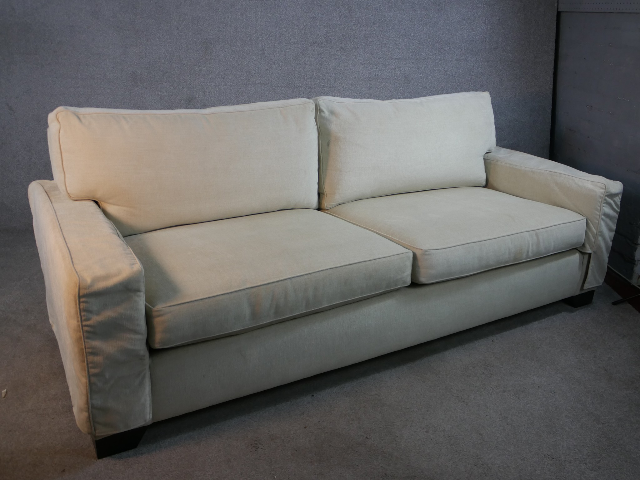 A contemporary Kingcome two seater cream upholstered sofa raised on block feet. H.84 W.120 D.100cm. - Image 4 of 7