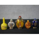 Five Chinese 20th century snuff bottles, including a reverse painted glass bottle with geisha design