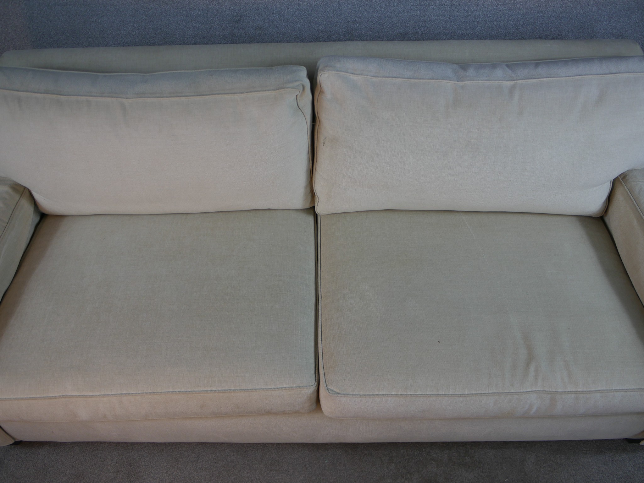 A contemporary Kingcome two seater cream upholstered sofa raised on block feet. H.84 W.120 D.100cm. - Image 2 of 7