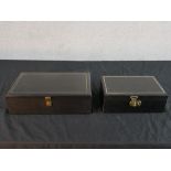 Two mid to late 20th century black faux leather jewellery boxes, one fitted and lined with red