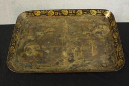 A late 19th century rectangular tray with rounded corners; with Japanese garden scene within leaf