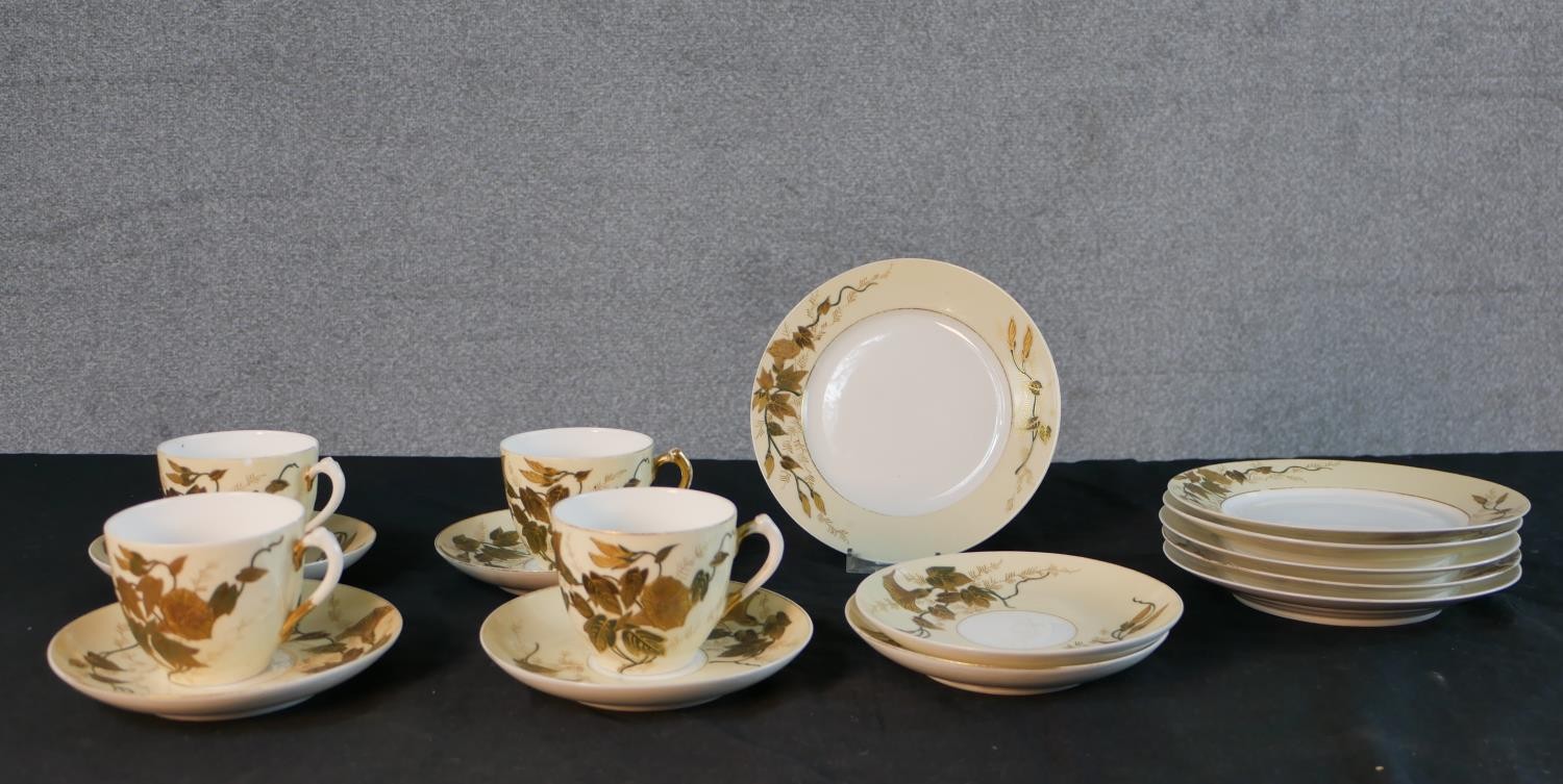A French D & Co Limoges porcelain part tea set, decorated with gilded morning glory designs,