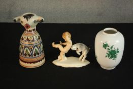 A Royal Dux hand painted vintage figure of a young boy and baby goat along with a Spanish bull
