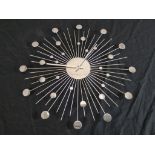 A mid 20th century style polished metal sun or sputnik style wall clock. H.50 W.50 D.1cm