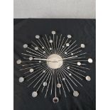 A mid 20th century style polished metal sun or sputnik style wall clock. H.50 W.50 D.1cm