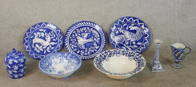 An assortment of blue and white pottery comprised of three Portuguese pottery plates each