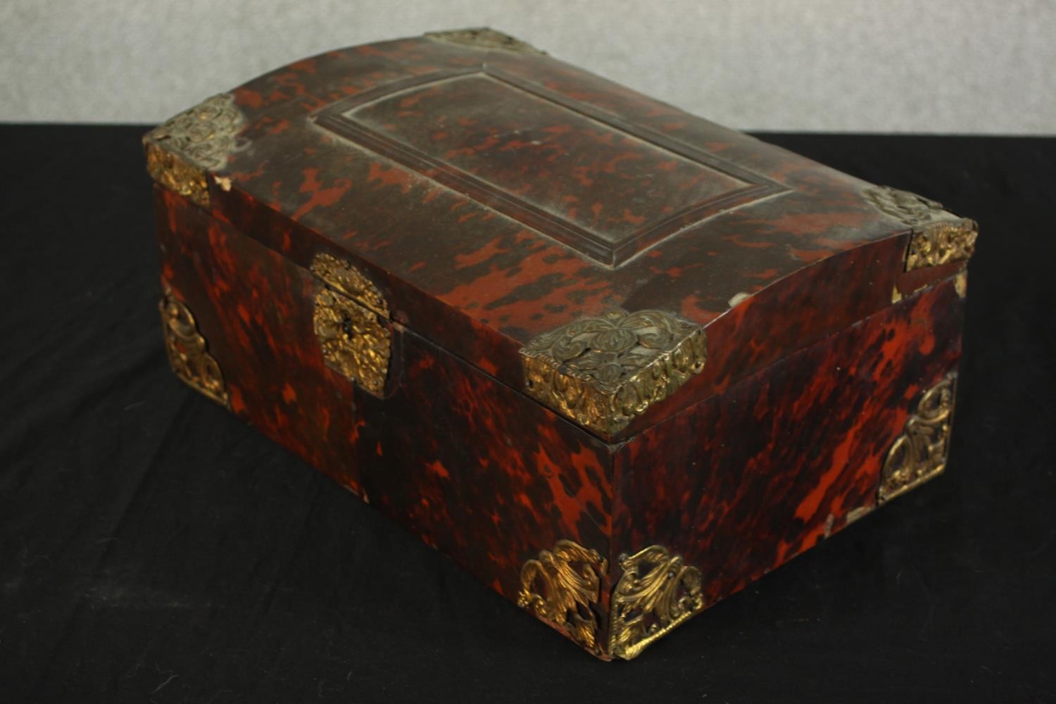 A 19th century tortoiseshell mounted dome topped box with brass mounts, opening to reveal velvet - Image 3 of 8