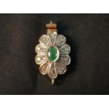 A Victorian yellow metal (tested as 9ct) rose cut diamond and emerald floral design clasp. Set to