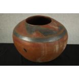 A pre - Columbian style painted pottery globular vessel pot/vase with grey painted geometric