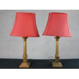 A pair of late 20th century Laura Ashley brass Corinthian column table lamps, with fluted stems