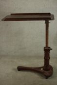 A late 19th / early 20th mahogany adjustable bed tray raised on triform base table terminating in