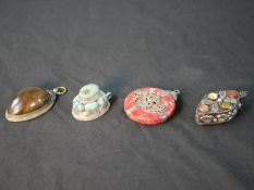 A collection of gem set bottles and pendants, including a turquoise and white metal pendant, a white