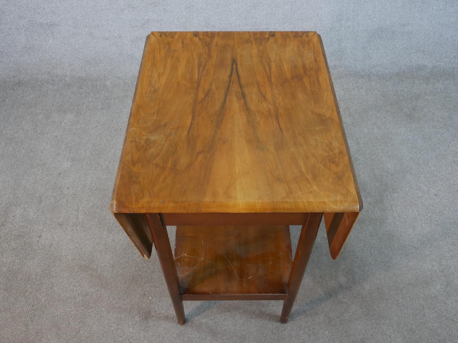 A mid 20th century mahogany drop leaf table with shelf undertier raised on square tapering - Image 2 of 6