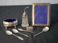 A collection of mixed silver items, including a silver and cut glass atomiser, a blue glass lined