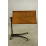 A late 19th / early 20th century mahogany and cast iron bed tray raised on splayed base