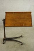 A late 19th / early 20th century mahogany and cast iron bed tray raised on splayed base