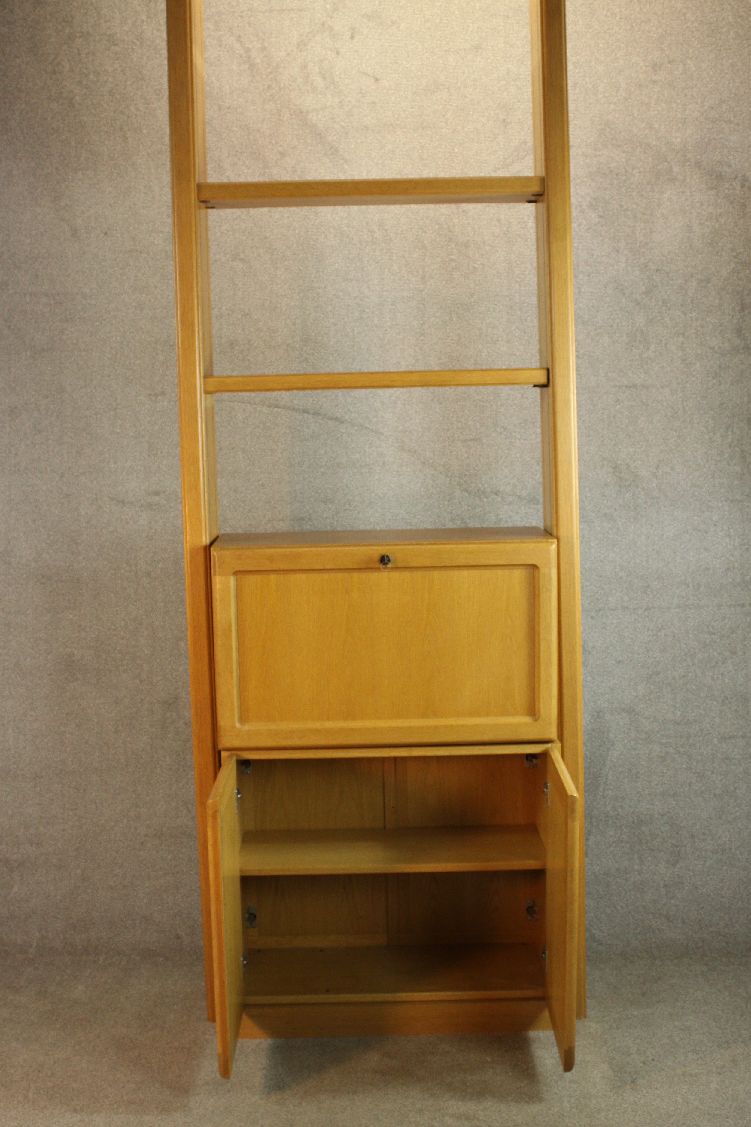 A late 20th century oak bureau cabinet, with shelves over a fall front containing drawers, - Image 5 of 11