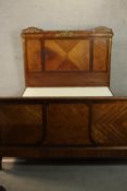 A late 19th century French walnut double bed, with ornate gilt metal mounts, with quarter veneered