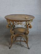 A late 19th/early 20th century circular wicker table, possibly French, with an oak top and