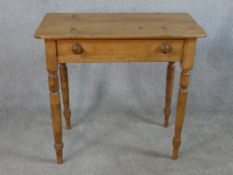 A late 19th / early 20th century stripped pine side table raised on turned legs. H.70 W.75 D.40cm.