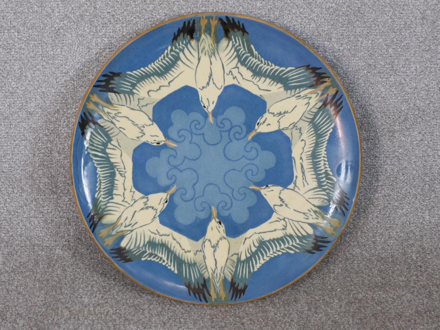 Danish Herman Kahler (HAK), a large ceramic glazed charger with seagull design on pale blue