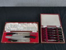 A Gee & Holmes Ltd Sheffield stainless steel and horn carving set, in a fitted case, together with a