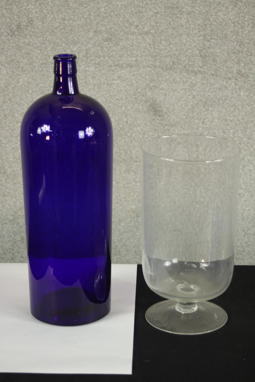 A large Bristol Blue glass apothecary bottle and clear glass storm lantern. H.40 Dia.13cm. (largest)