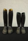 A pair of Aigle black leather riding boots; size XL together one other pair of black riding boots.