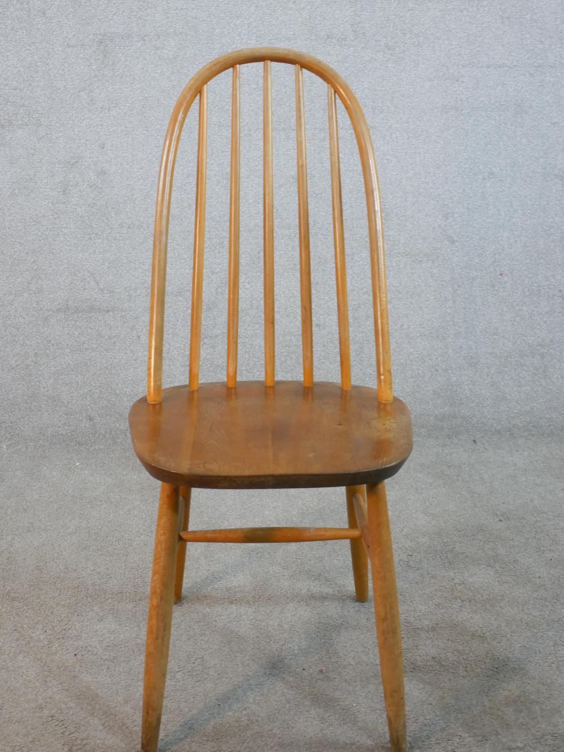 A set of four 20th century Ercol style blond elm hoop back Windsor dining chairs. - Image 4 of 6