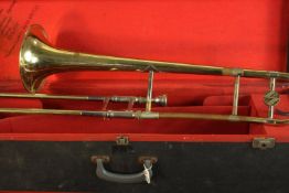 An early 20th century brass trombone. L.87 W.25 D.22cm.