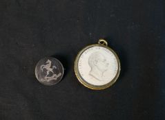 A Victorian tortoiseshell and silver brooch with rearing horse and inscription along with a glass