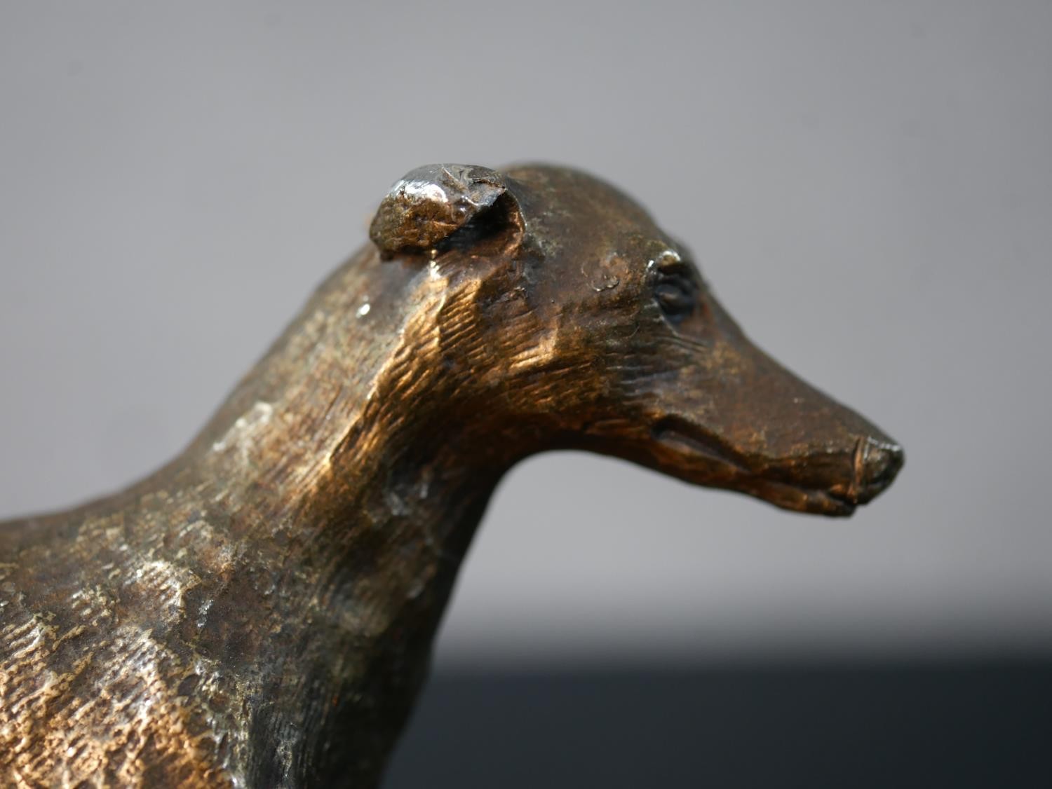 A mid 20th century cast brass Greyhound racing trophy with applied plaque. H.13 W.16.5 D.9cm - Image 3 of 6