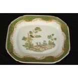 A 20th century Chinese octagonal porcelain plate, decorated with a fox and a bird within a green and