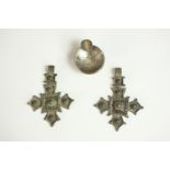 Two silver plated filigree wirework cross pendants along with a novelty miniature silver coin