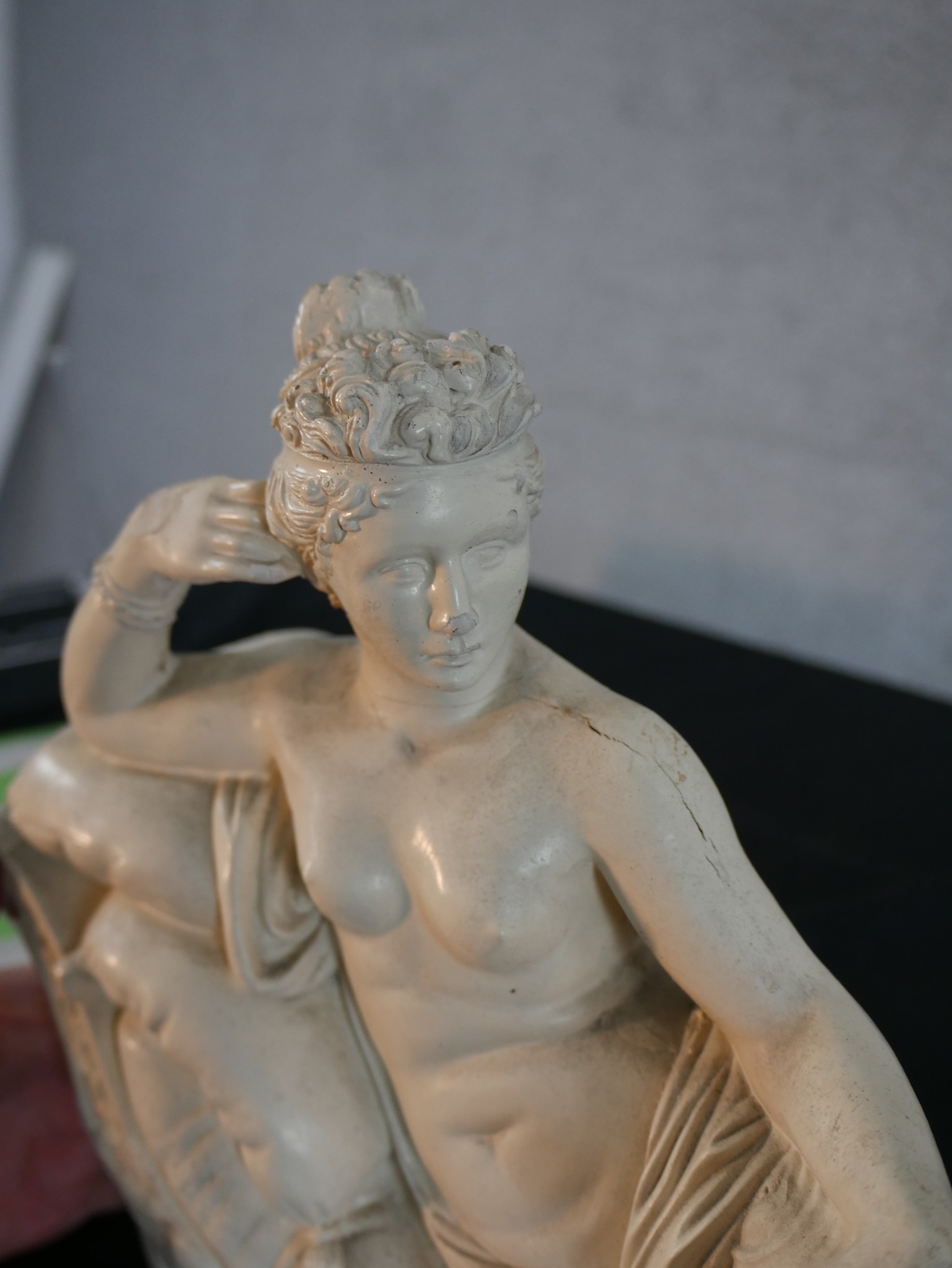 A contemporary plaster figure of a reclining Roman style lady. H.26 W.38 D.11cm - Image 4 of 5