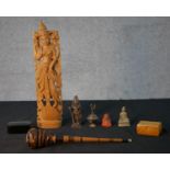 A collection of figures and boxes, including a bronze Indian deity, brass Buddha, carved hardwood