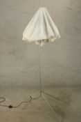 A contemporary steel standard lamp, with a slender stem, on an adjustable tripod base. H.170 W.78