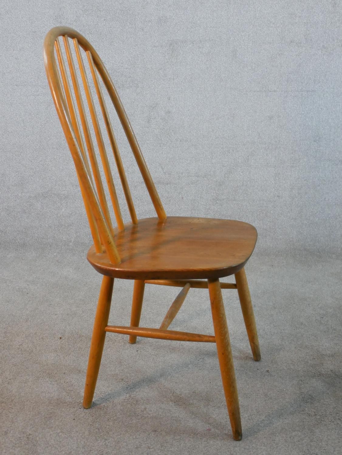 A set of four 20th century Ercol style blond elm hoop back Windsor dining chairs. - Image 6 of 6