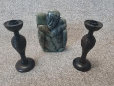 A pair of 20th century ring turned hardwood candlesticks, with baluster stems and on circular