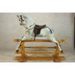 Harrods Knightsbridge grey painted rocking horse. raised on pine and iron rocking base, with