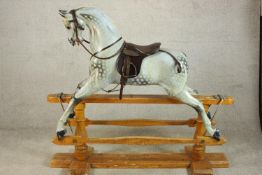 Harrods Knightsbridge grey painted rocking horse. raised on pine and iron rocking base, with