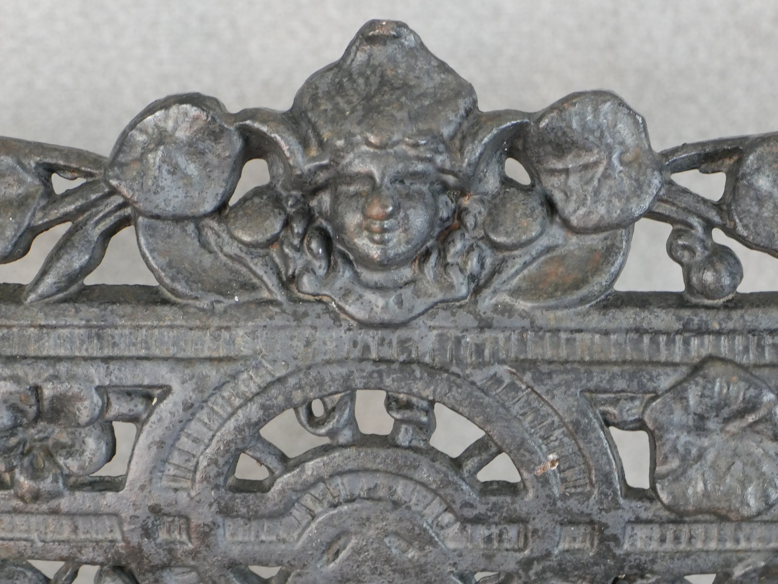 A Victorian Coalbrookdale style cast iron garden bench, in nasturtium pattern, missing one seat - Image 6 of 9