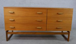 Ernst Gomme for G-Plan, a 1970s teak sideboard, of rectangular form with two banks of three short