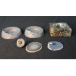 A collection of ashtrays and geode slices, including two Art Deco pewter race car ash trays and a
