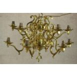 A twelve branch brass electrolier of Gothic style, H.54 Dia.72cm
