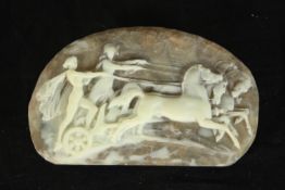 A vintage Cameo design moulded resin statement belt buckle depicting a horse pulled chariot and