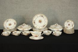 A Spode Rockingham part dinner service to include plates, soup bowls, lidded tureens and sauce boat.