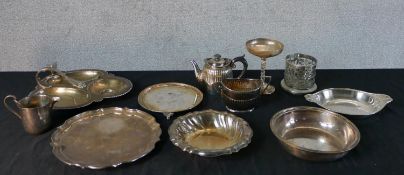 Assortment of silver plate to include dishes, plates, bottle coaster, teapot etc. H.8 W.28 D.27.