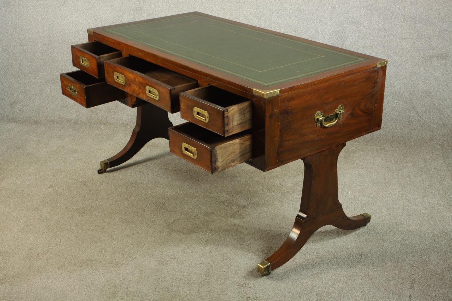 A contemporary mahogany Chinese style leather inset writing table with brass campaign style - Image 6 of 12