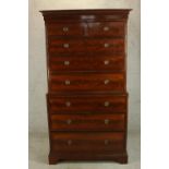 A George III mahogany chest on chest, the top section with dentil cornice with two short over